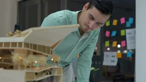 Architects are working on a building model at modern office. Stock Footage 106864409