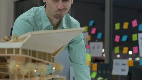 Architects are working on a building model at modern office. Stock Footage 106864551