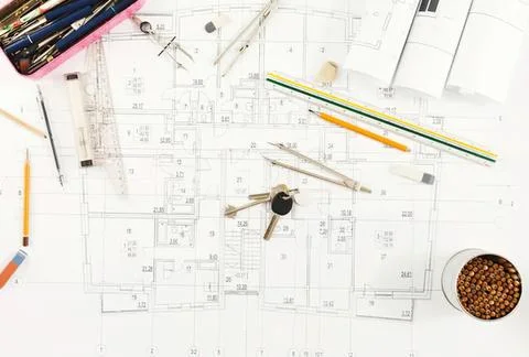 Architects' blueprints and drawing tools on table Stock Photos