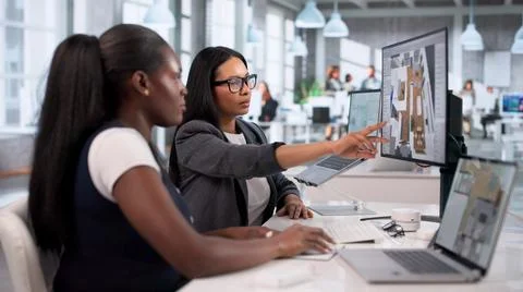 Architects Collaborate On Laptop Using 3D CAD Software To Design Remodeled Ho Stock Photos