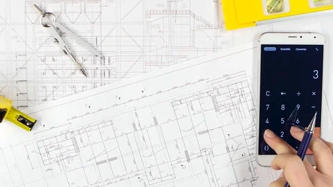 Architects compare the calculations with the drawing, and discuss further Vidéo 73676024