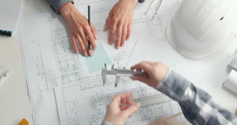Architects create a sketch of the project. Designers are developing a drawing.  Vídeo Stock 155341514