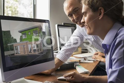 Architects discussing a green construction project, designing and building ef Stock Photos