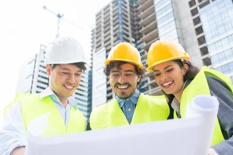 Architects with ground plot on construction site Fotos de archivo