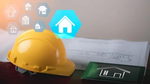 The architect's hat rests on the table. Stock Photos