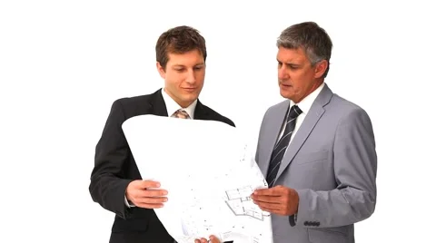 Architects holding a building plan Stock Footage