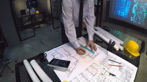 Architects looking blueprints Stock Footage 210548093