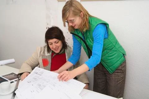 Architects looking at drawings Stock Photos