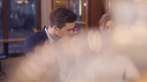 Architects meet in the café and discuss Stock Footage 122575698