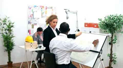 Architects or engineers in creative office looking at design plans 스톡 동영상 32749749