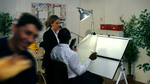 Architects or engineers in creative office with male cleaner cleaning window Vídeo Stock 32749754