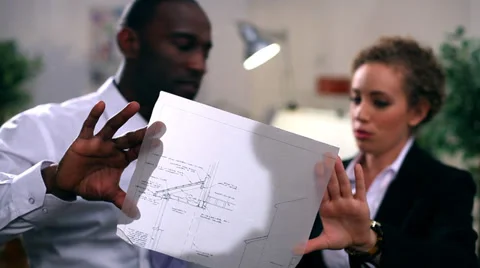 Architects or engineers in creative office looking at design plans Vídeo Stock 32749776