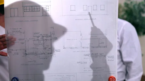 Architects or engineers in creative office looking at design plans. 스톡 동영상 32749851
