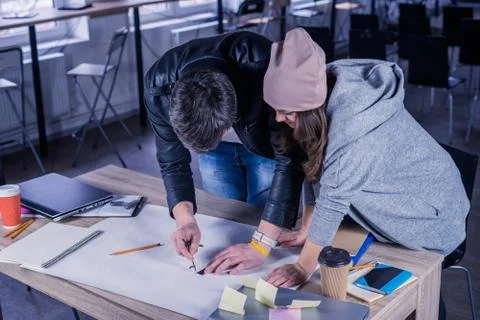Architects people drawing construction project on desk. Stock Photos