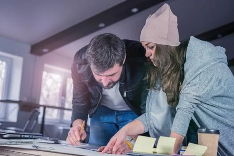 Architects people drawing construction project on desk. Stock Photos