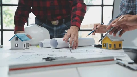 Architects planning construction of new house at the office table Stock Footage 325926812