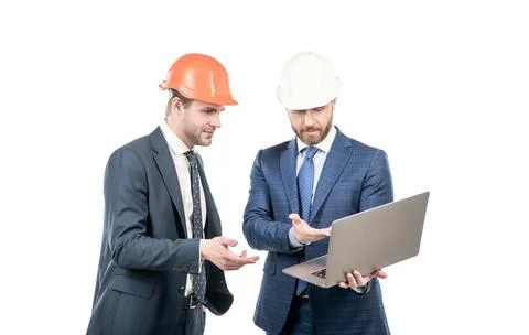Architects planning work. chief engineer and executive in hardhat use computer. Stock Photos