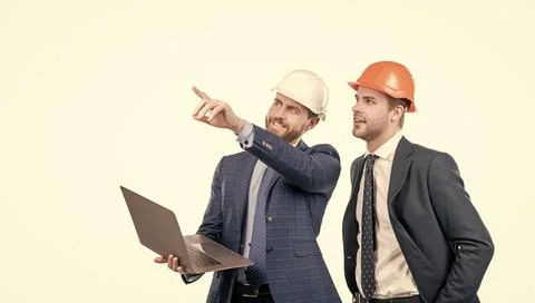 Architects planning work. chief engineer and executive in hardhat use computer Stock Photos