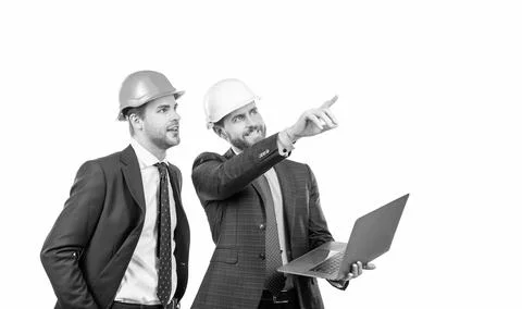 Architects planning work. chief engineer and executive in hardhat use computer Stock Photos
