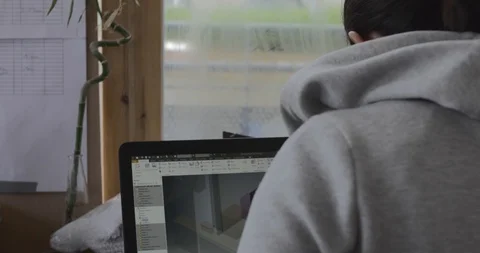 Architects reading plans and working on compluter Stock Footage 119376868