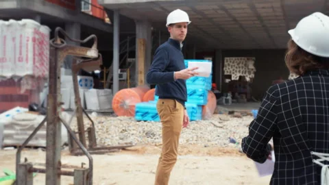 Architects reviewing structural design and technical details at constructio.. Stock Footage 329640875