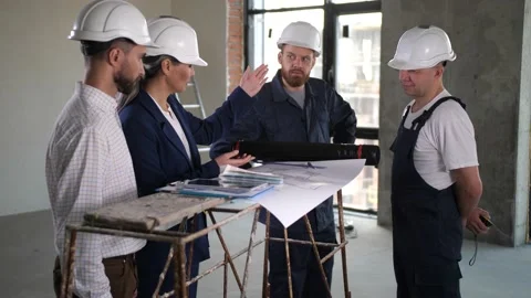 Architects setting task for builders during work Stock Footage 149075811