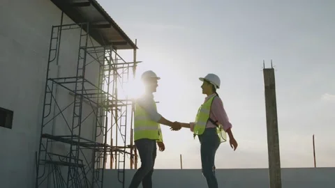Architects shake hand with building engineer contractor or owner concept Stock Footage 146027246