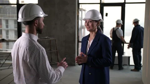 Architects shaking hands thanking for joint work Stock Footage 149075304