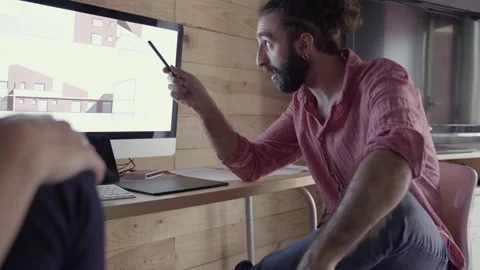 Architects speaking about project in front of computer screen Stock Footage 132810286