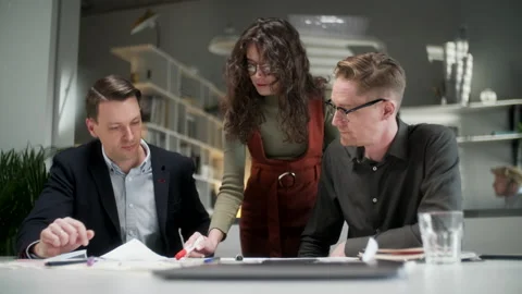 Architects Team Are Working On Paper Blueprint. Business Woman Suggest Idea To Видео 132844805