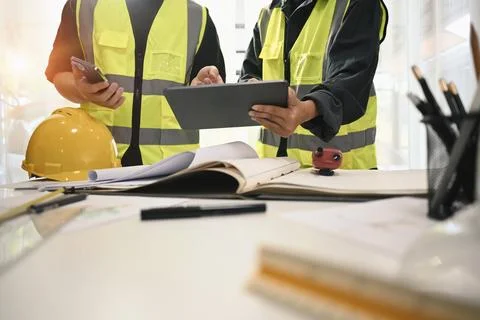 Architects team using digital tablet, discussing and planning development Stock Photos