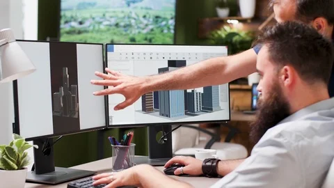 Architects using 3D software to discuss new building mock ups Stock Footage 110480772