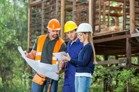 Architects Using Digital Tablet At Construction Site 写真素材