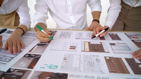 Architects working on blueprint close up Stock Footage 88607481