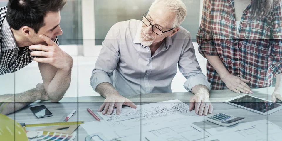 Architects working on plans, light effect, geometric pattern Foto stock