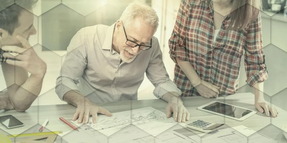 Architects working on plans, light effect, geometric pattern 스톡 사진