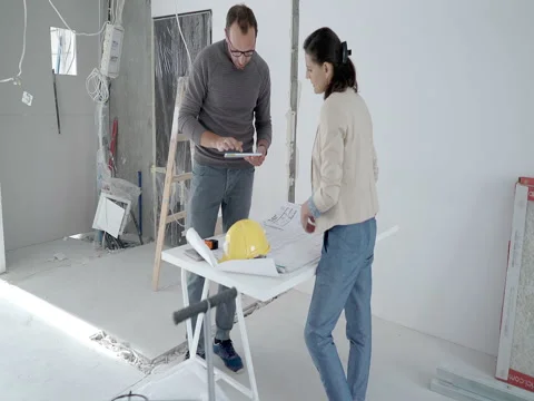Architects working on the project and looking on tablet, steadycam shot Stock Footage 76509863