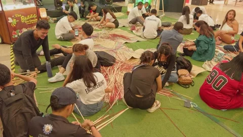 Architectural and engineering students learning about bamboo at a free workshop. Stock Footage 284516934