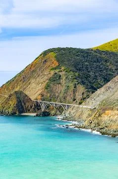 The architectural Big Creek Bridge spanning the turquoise waters of Big Sur.. Stock Photos
