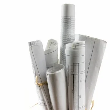 Architectural blueprints and blueprint rolls on white background Stock Photos