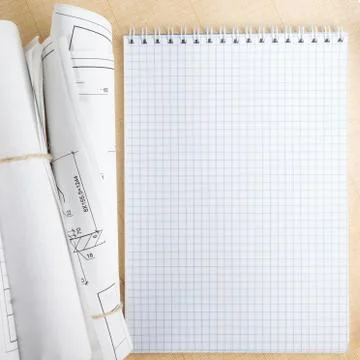 Architectural blueprints and blueprint rolls on white background Stock-Fotos