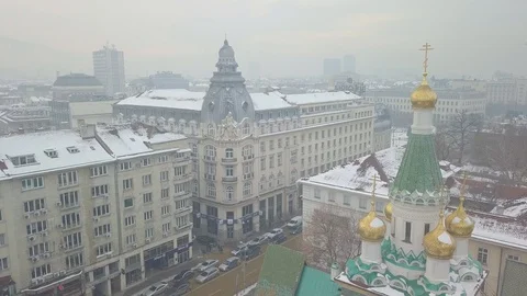 Architectural building in the center of sofia covered in snow (D-log) 스톡 동영상 100802476