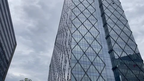 Architectural Building with Geometric Facade and Glass Panels Stock Footage 337722337