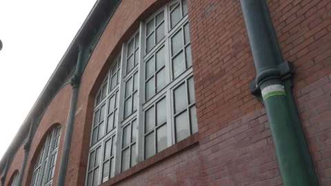Architectural building window of a industrial storage facility in Paris. 스톡 동영상 257607917