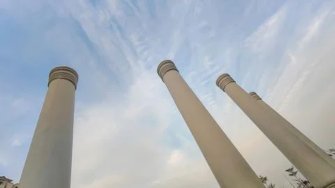An architectural close-up of pillars touching  the blue sky. Touching the sky Stock-Fotos