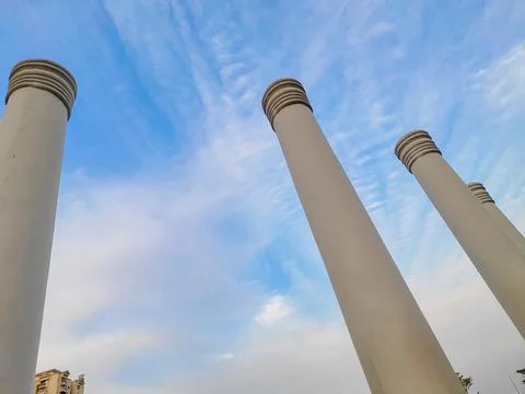 An architectural close-up of pillars touching  the blue sky. Touching the sky Stock Photos