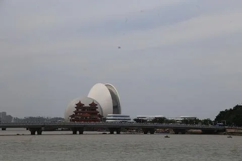An architectural complex in the style of Chinese design, situated by the rive Stock Photos