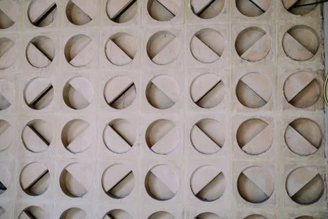 Architectural concrete geometric wall pattern with circular and diagonal shap Stock Photos
