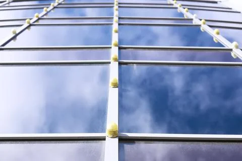 Architectural detail of the facade with multiple reflections of other build.. Stock Photos