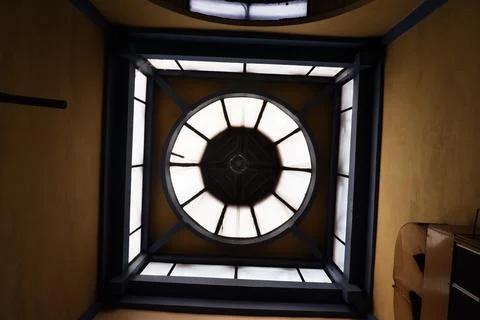 Architectural Detail of Round Ceiling Light Fixture with Black Frame Foto stock